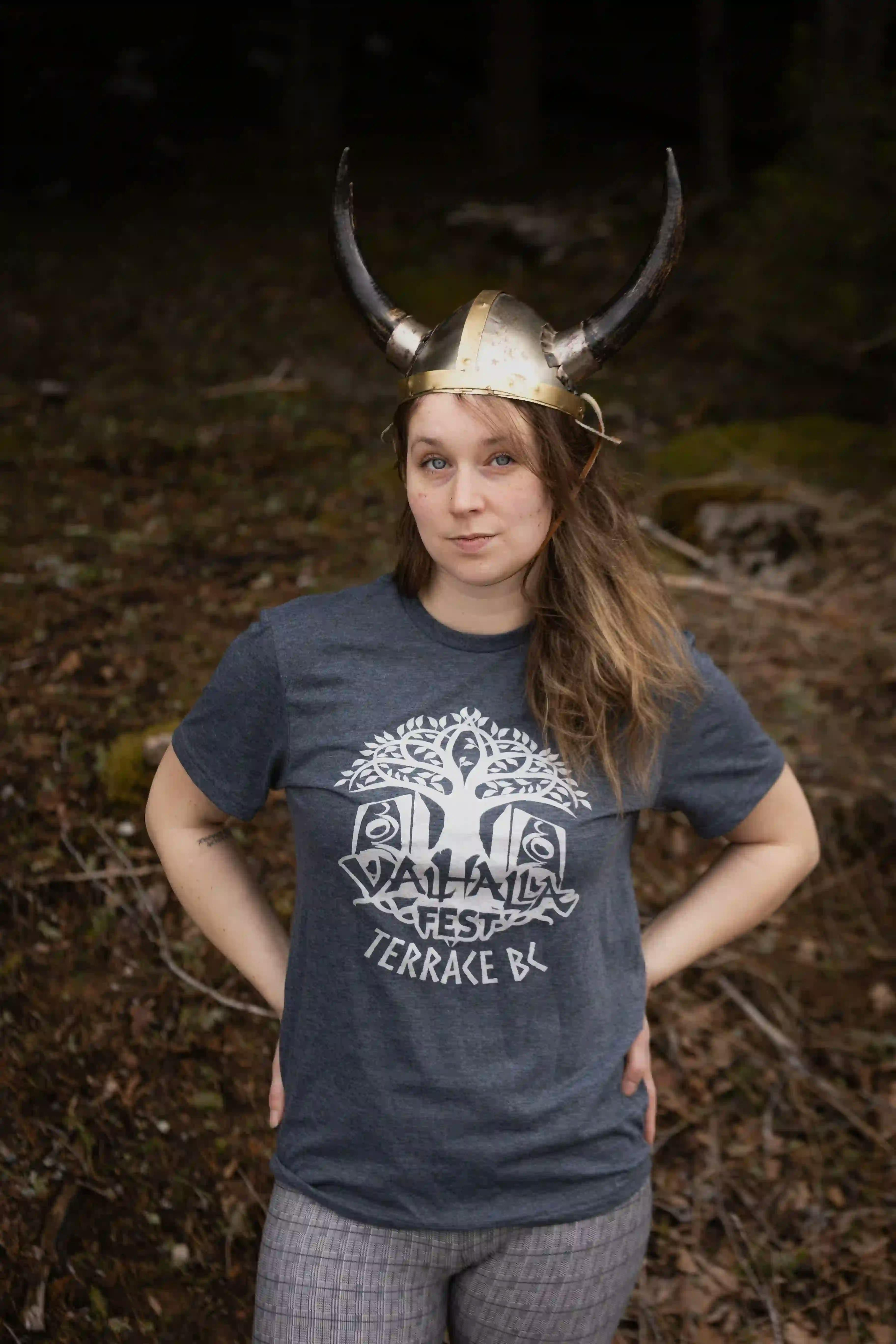 Woman wearing ValhallaFest t-shirt and Viking helmet.