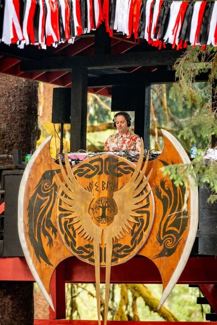 Leif's Beach stage featuring the ValhallaFest shield, with a performer and bunting decorations.