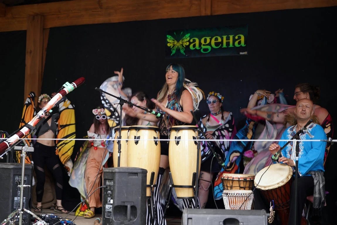 AgeHa acoustic stage at ValhallaFest, showcasing live performances in a forest clearing.